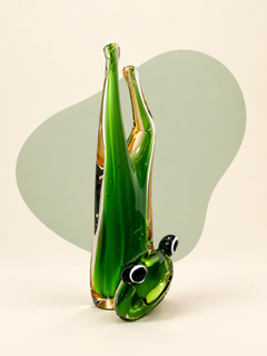 Green and amber glass frog sculpture — front view