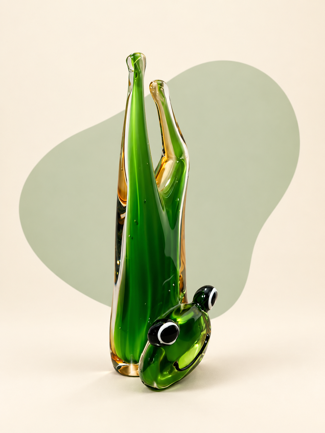 Green and amber glass frog sculpture — front view