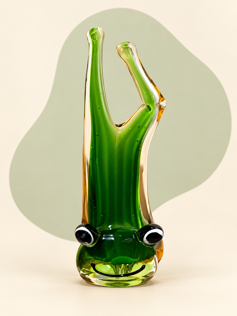 Green and amber glass frog sculpture — side view