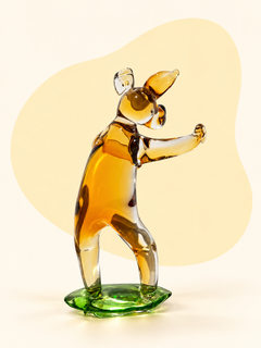 Amber and clear glass dog sculpture — front view