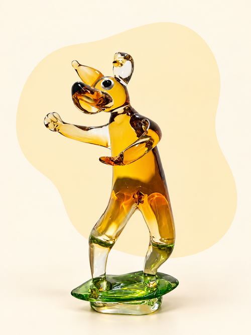 Amber and clear glass dog sculpture — side view