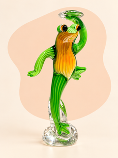 Green and amber glass character sculpture — side view