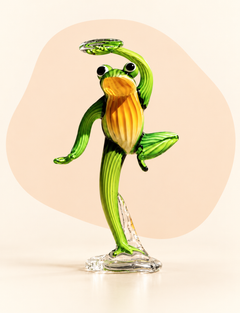Green and amber glass character sculpture — front view