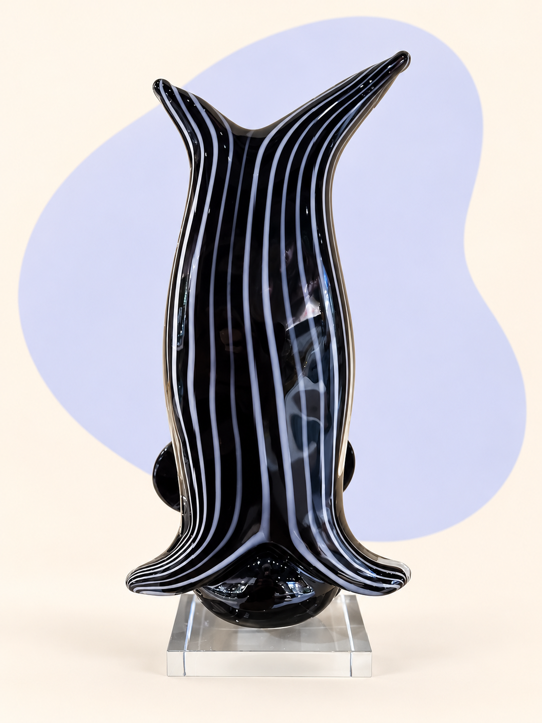 Black striped glass dolphin sculpture — rear view
