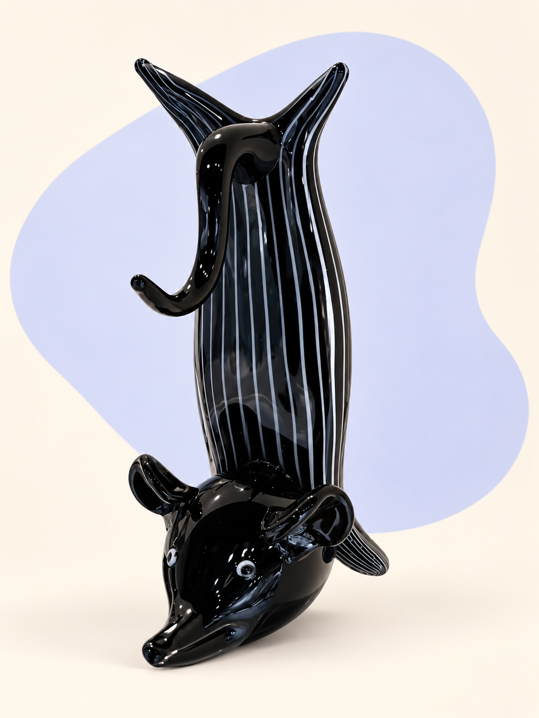 Black striped glass dolphin sculpture — angle view